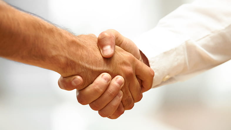 two people shaking hands