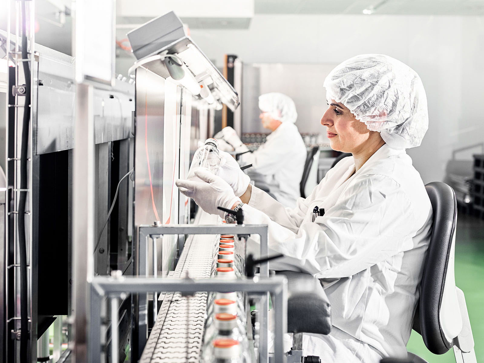 Female employee from Bern filling bottles