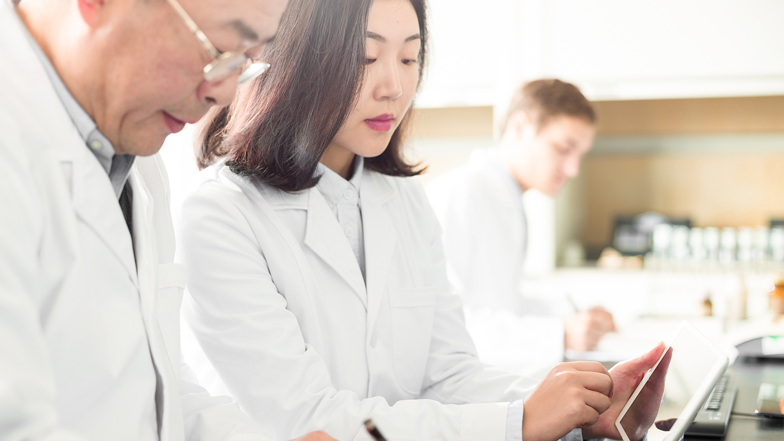 Researchers taking notes