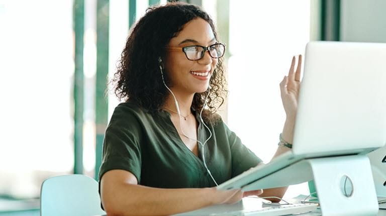 job candidate waves during a virtual interview